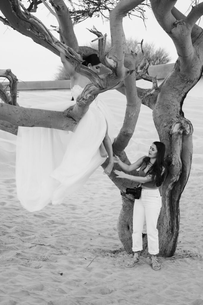 Wedding photographer posing a bride