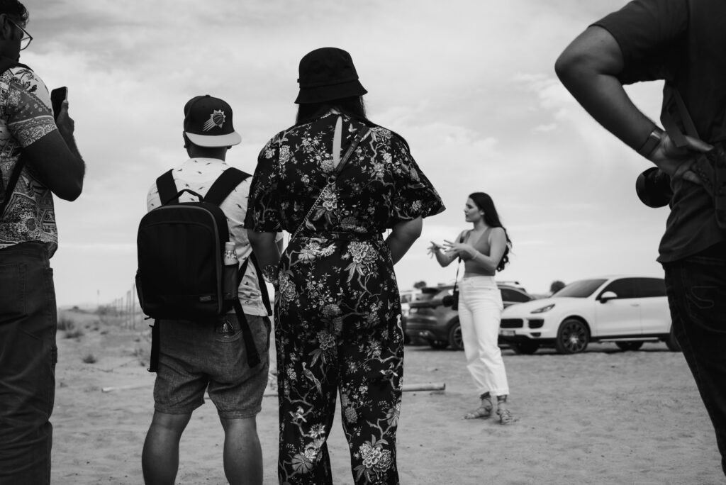 Black and white image of a photography workshop in the desert