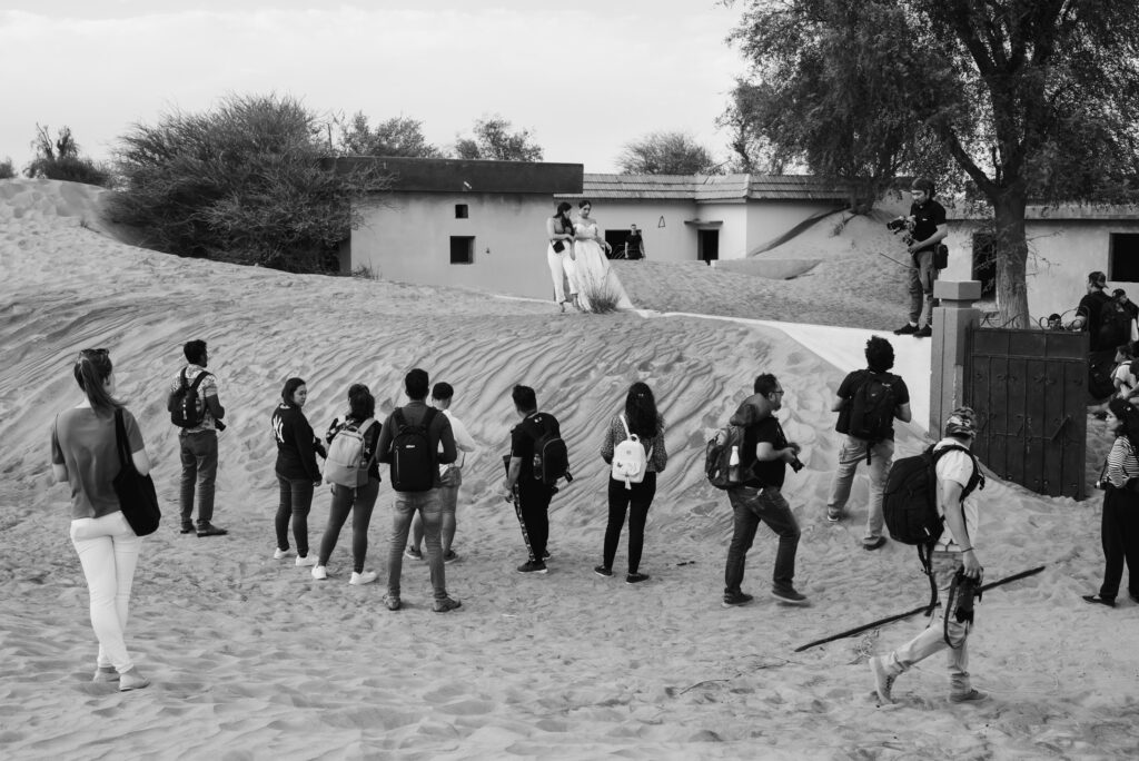 Black and white image of a photography workshop in the desert